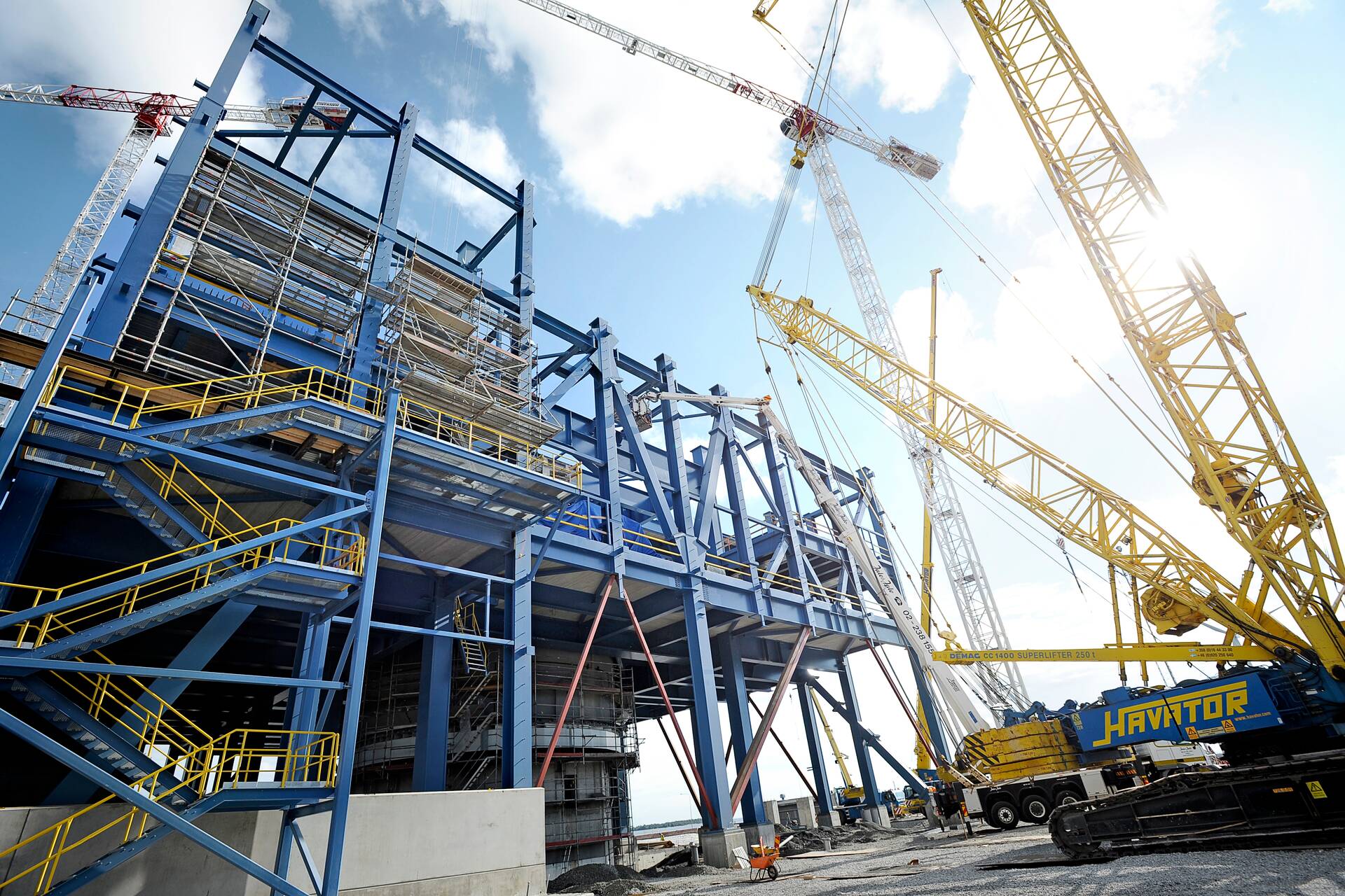Silhouetted business professionals in a modern, high-tech office lobby with a glowing blue upward-trending arrow and data visualizations.
